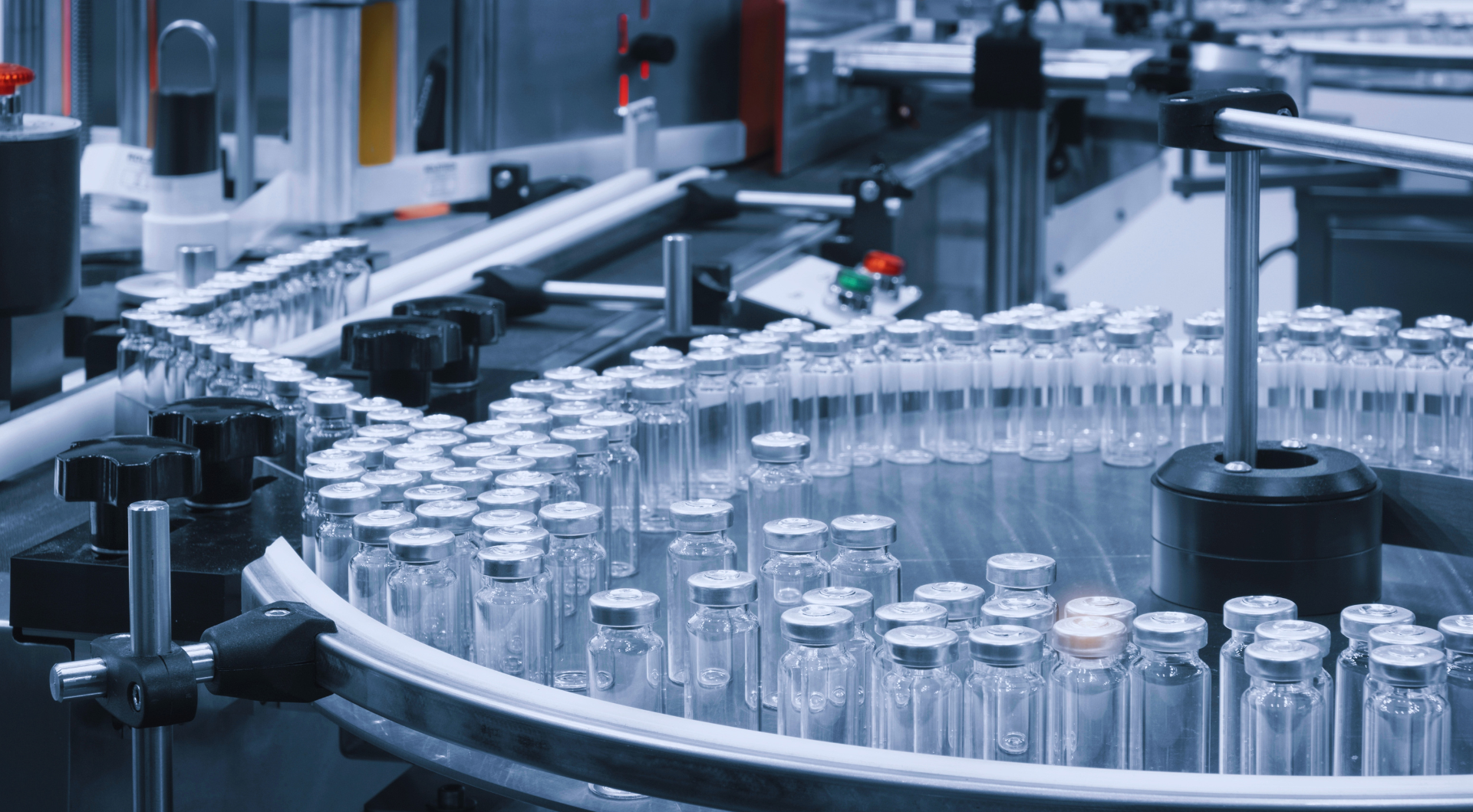 Automated vial filling line in a pharmaceutical manufacturing facility